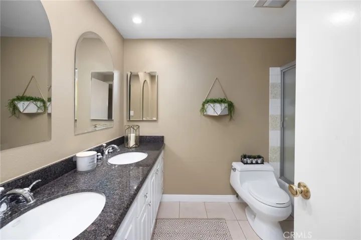 Upstairs hall "full" bath with dual sinks, granite countertops & bathtub with shower overhead~