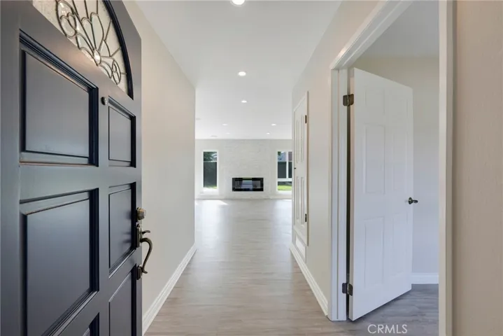 View of floor to ceiling stone fireplace as you enter