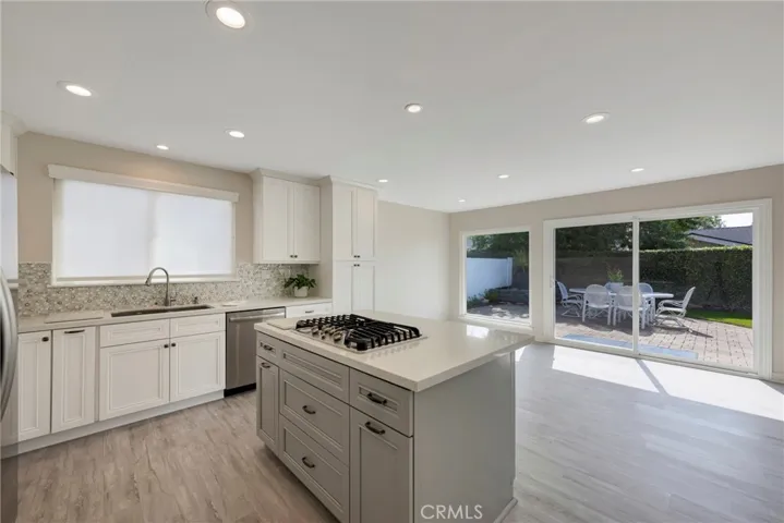 White Shaker cabinets and gas cooktop