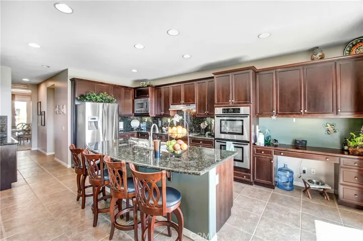 Lots of kitchen counter space, a secretary desk in the kitchen, open to the butler pantries to the dining room