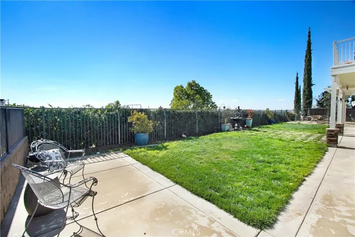 Rear yard with wrought iron fencing