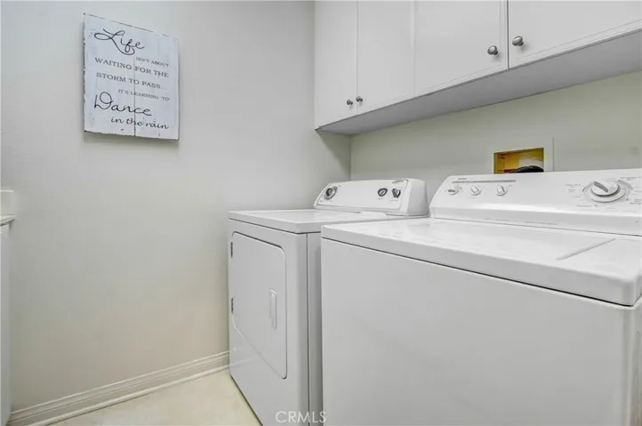 Laundry room with lots of cabinets, and deep laundry sink