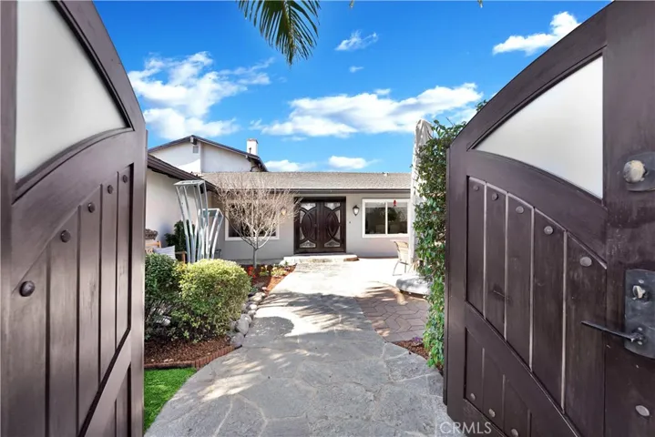 Enter front courtyard  through beautiful double door gate