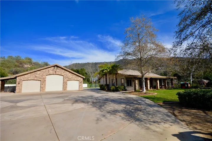 6 car garage with RV door, hookups and guest lodge