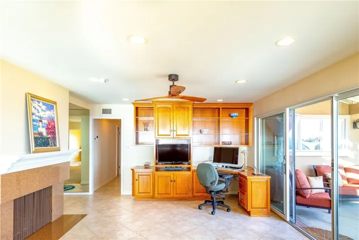 Family room area with a fireplace and doors to patio