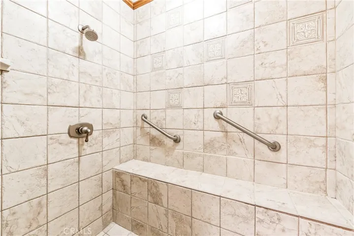 This beautiful walk-in shower used to be the bathtub.  Now that's a great home improvement!  Now that's a very nice shelf!   Plus, the shower head is brand​​‌​​​​‌​​‌‌​​‌​​​‌‌​​​‌​​‌‌​​‌‌​​‌‌​​​​ new.