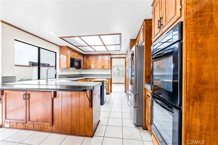 Double Ovens!!!! More extra storage under the counter, Bar stools would be great here!