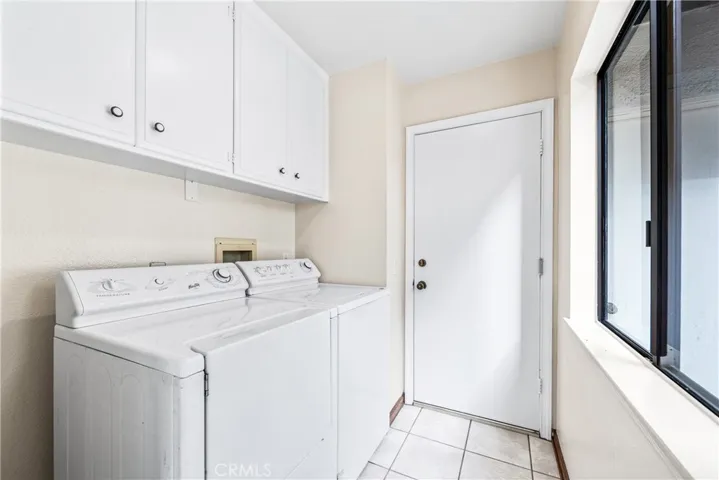 Inside laundry room, plus lots of storage.  These Maytag washer & dryer also comes with the home.