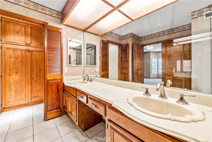 Master Bathroom.  That linen closet used to be the original shower.  Guess what?  More linen closet complete with pull out drawers.  The toilet area also features a door for privacy.