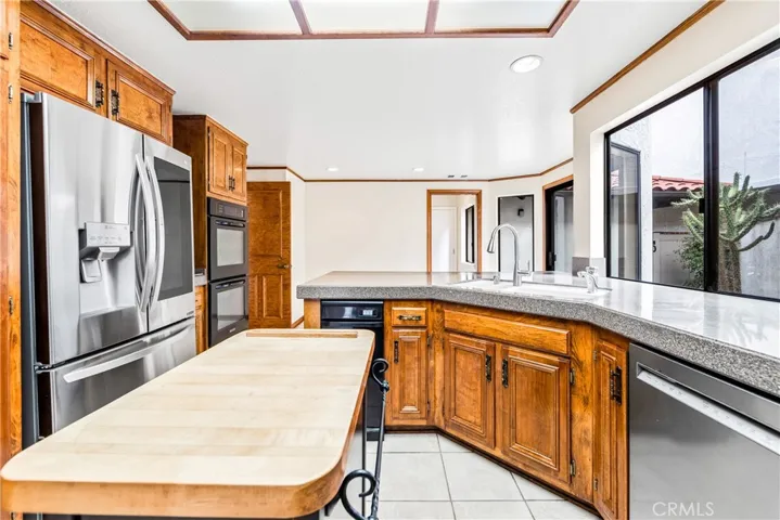 This LG Refrigerator comes along in the sale.  Nice view of the butcher block island too.