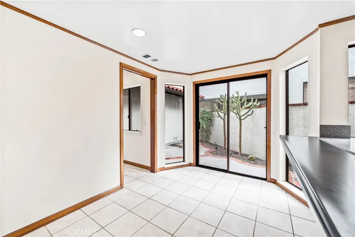 This recently painted home also has a very large side patio that extends from the wall of the garage all the way to the end of the kitchen.