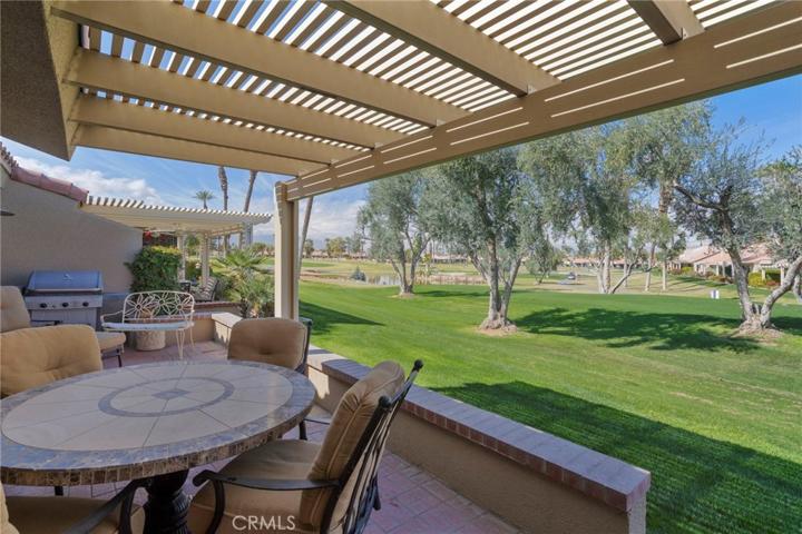 Extended covered patio with extensive golf course views.