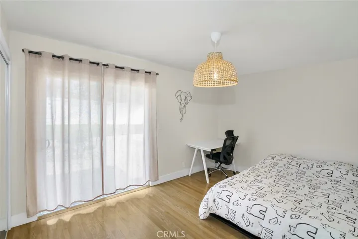 Another bedroom with access to the backyard