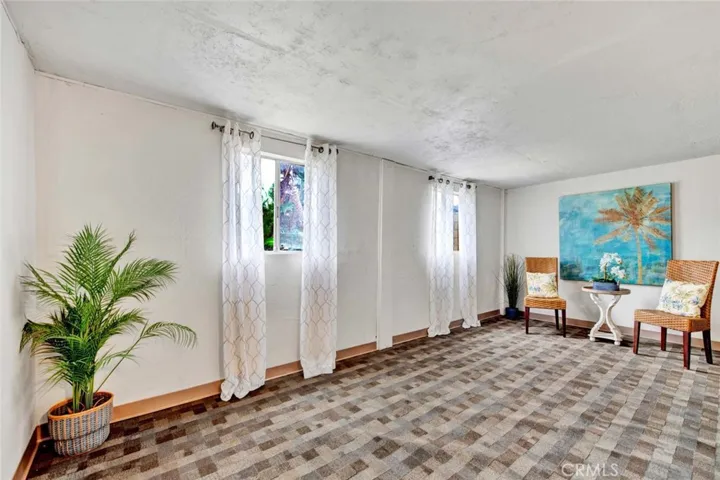 Added Enclosed Patio Room off the Garage that can be Used as an Office, Gym, Play/Hobby Room -- Approximately 200 Square Feet