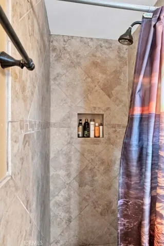 Primary Suite Bathroom has a Walk-In Shower