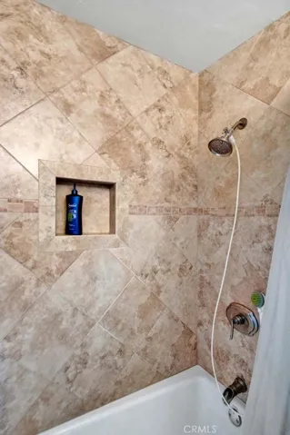 The Hall Bath has Granite Countertop and a Tub/Shower Combo