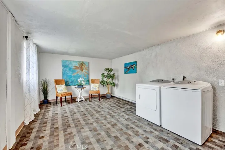 Enclosed patio has washer and dryer hook ups
