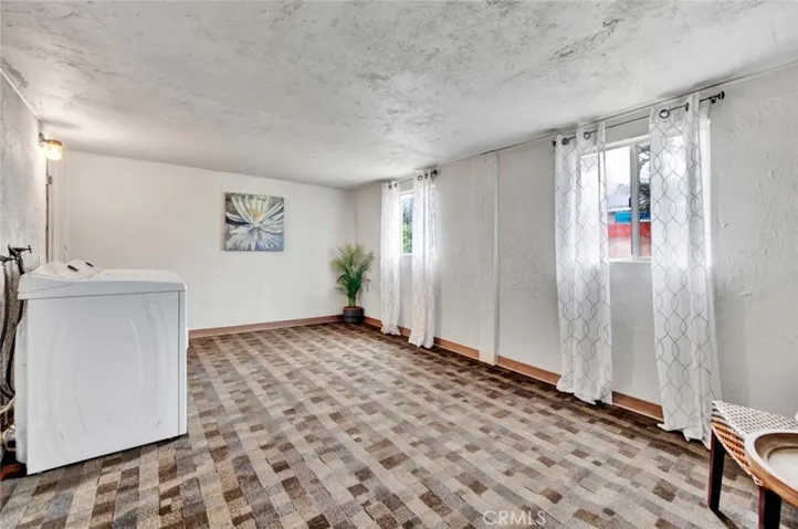 Enclosed patio has windows to see out to the backyard