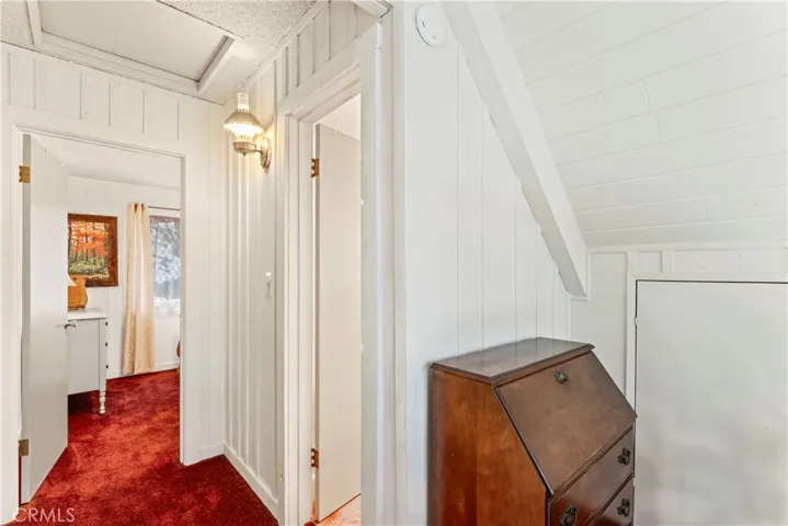 Upper level - 3/4 bath on right, guest room straight back, primary larger bedroom tot he left