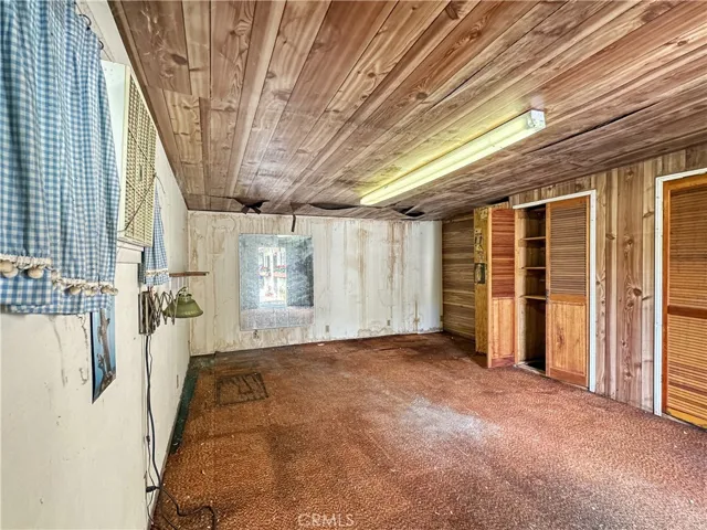 Storage Room in Rear Building attached to carport
