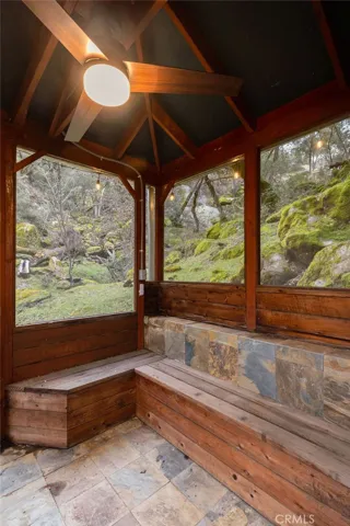 Screened gazebo with ceiling fan & light