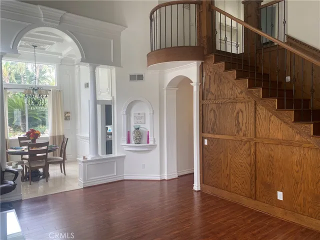 Entry and staircase with dining room in background