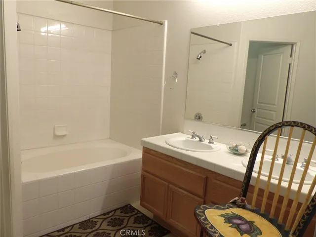 Master private bath with soaking tub, dual vanity, commode room and walk-in closet