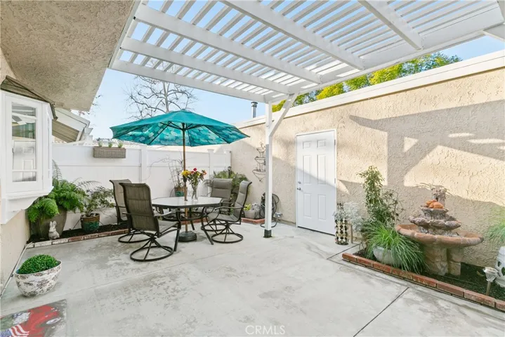 Wonderful Garden patio yard for your outdoor living! This leads to your attached 2 car garage as well.