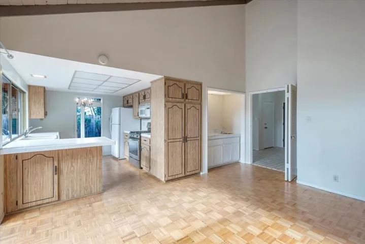 Easy to entertain with the kitchen next to the TV and game area.