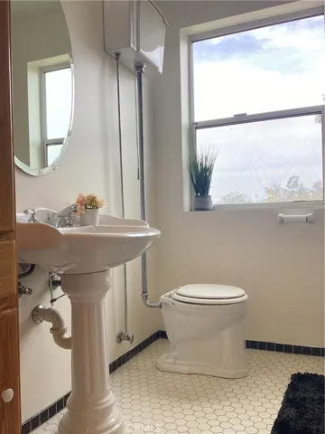 Vintage Bathroom With Claw Foot Tub and Pedestal Sink