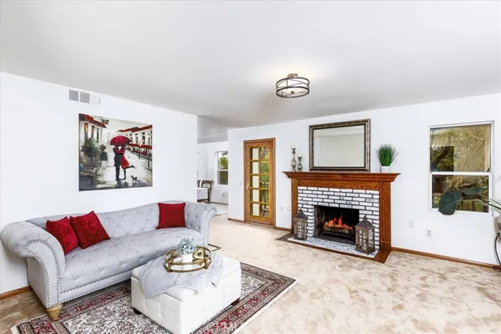 Formal Living Room With Wood Burning Fireplace