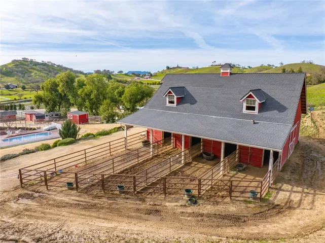 Barn with oil pipe turnouts fencing