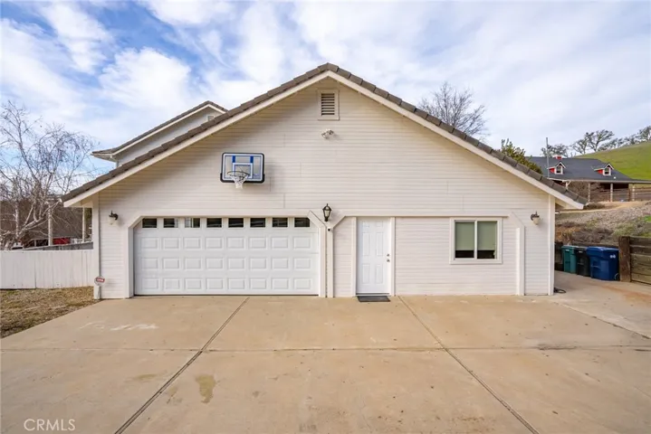 Side of the house showing garage and office/guest quarters with separate entrance