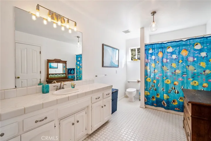 Shared upstairs bathroom with tub/shower