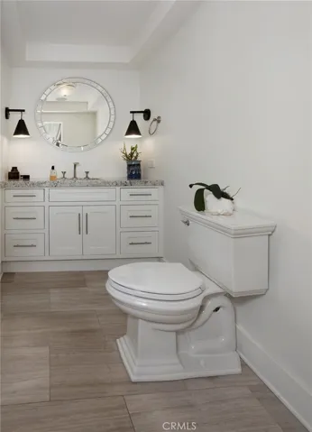 Half bathroom near kitchen and living area