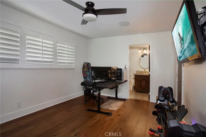 Second bedroom currently used as office and workout area