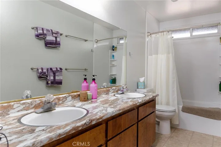 Guest bath with dual sinks and soaking tub.