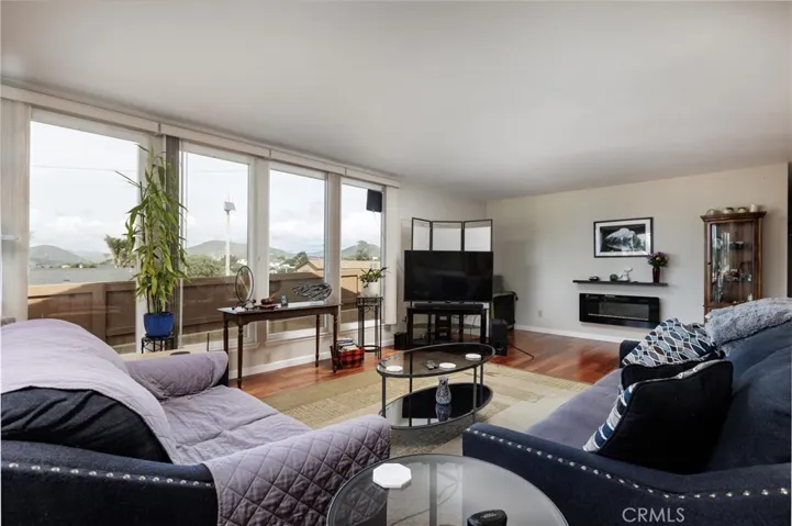 Living room with views of surrounding hills
