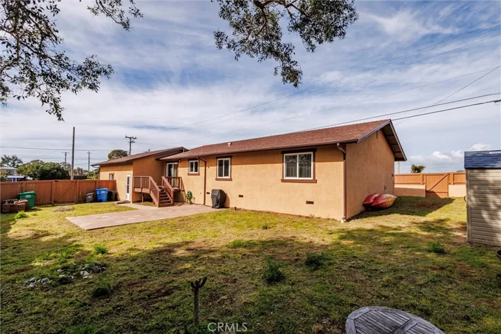 Large backyard with perimeter fencing for privacy.