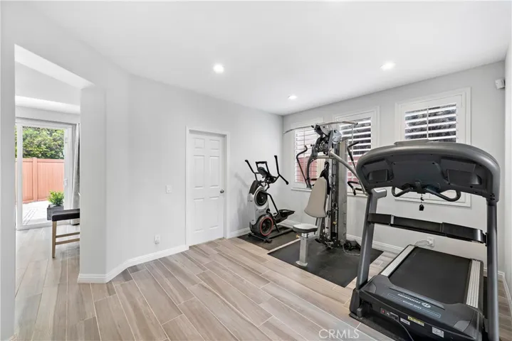 Downstairs family room currently used as a home gym.