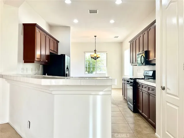 Large kitchen with a dining room on both ends
