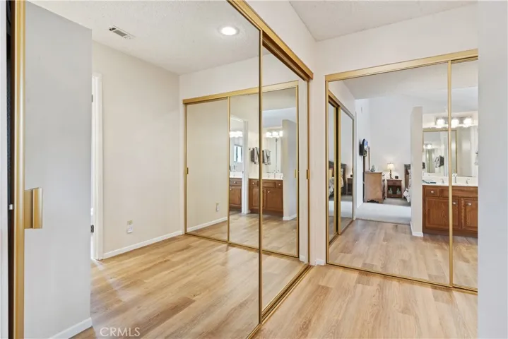 Two Closets with Mirrored Doors