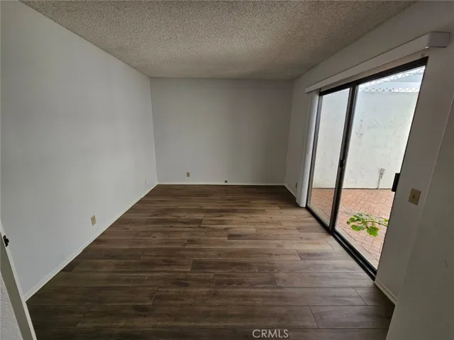 Bedroom with sliding door access to interior atrium