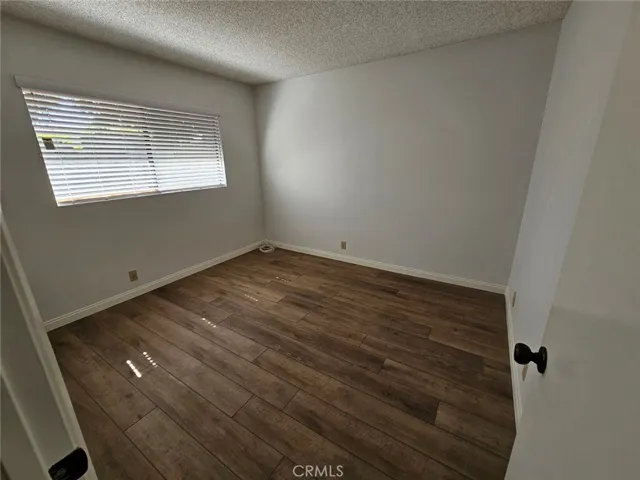 Bedroom with window view to the backyard