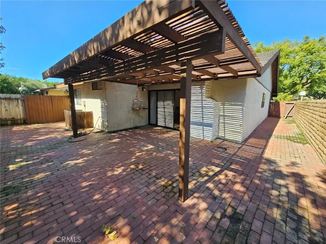 Low maintenance back yard with covered patio and block walls