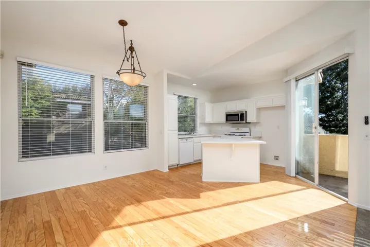 Dining Room and Kitchen are spacious and have direct access to the Patio space.