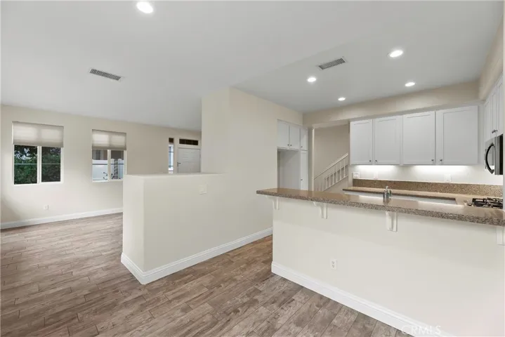Kitchen opening to Living Room