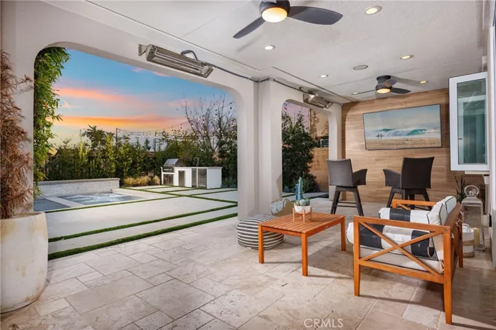 Covered California room with heaters, TV and bar service