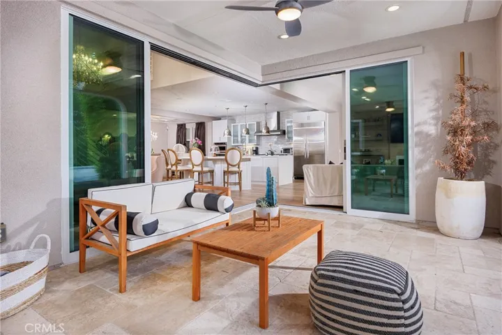 Sliding doors open to pool/patio