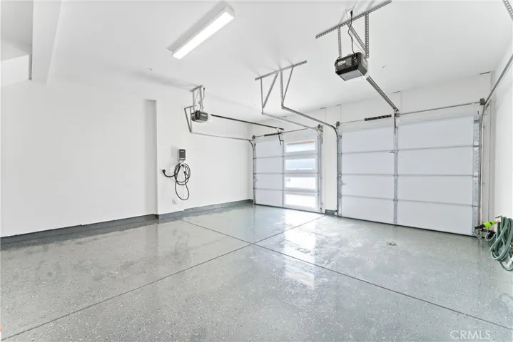 Two-car garage with epoxy floor and EV charger